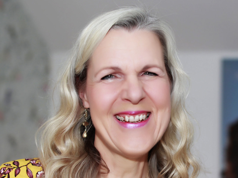 Photo of mental health expert Manuela Surgeon, smiling.