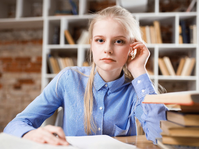 Dealing with exam stress- female student studying.